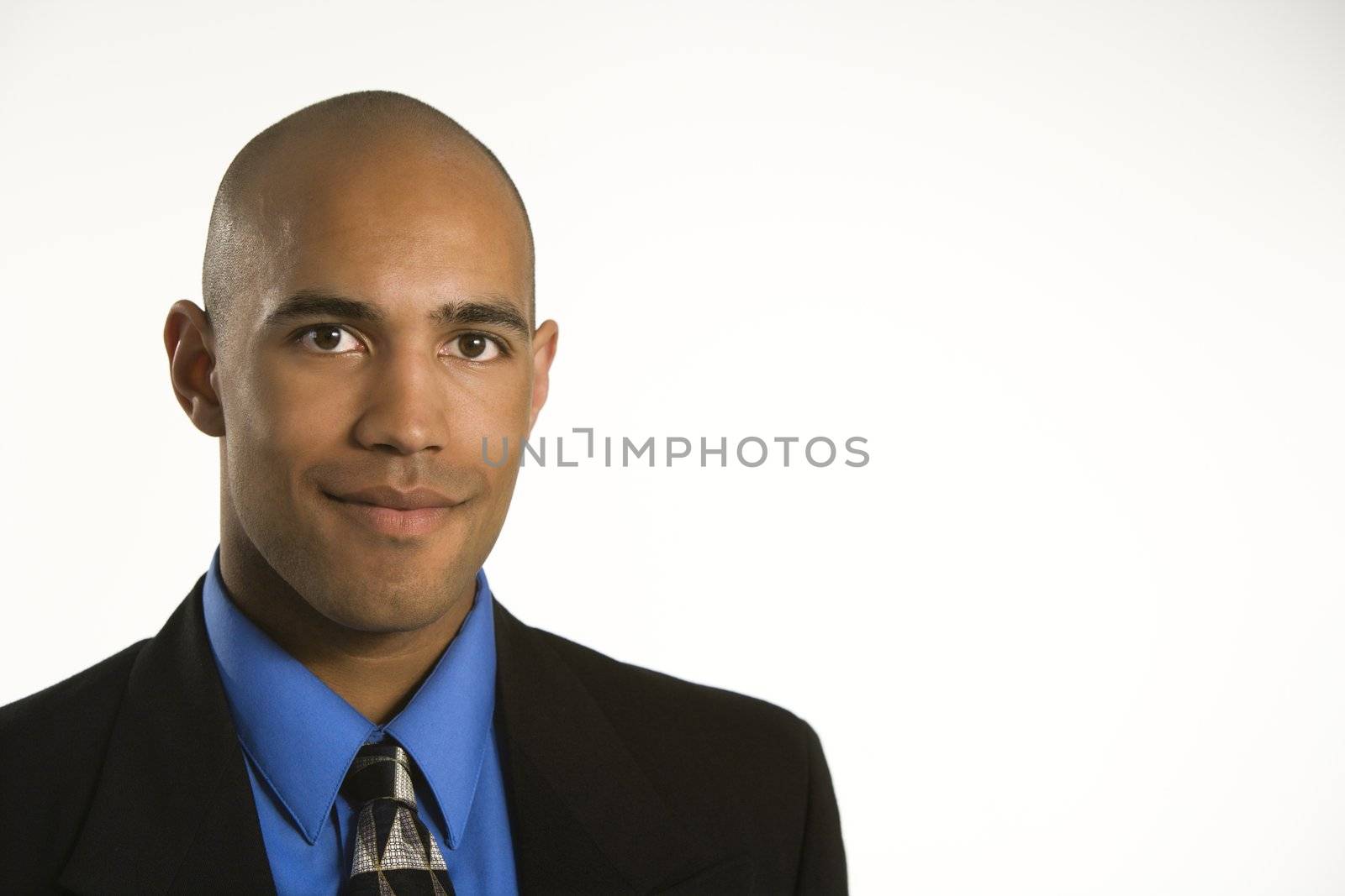 Head and shoulder portrait of African American man in suit.