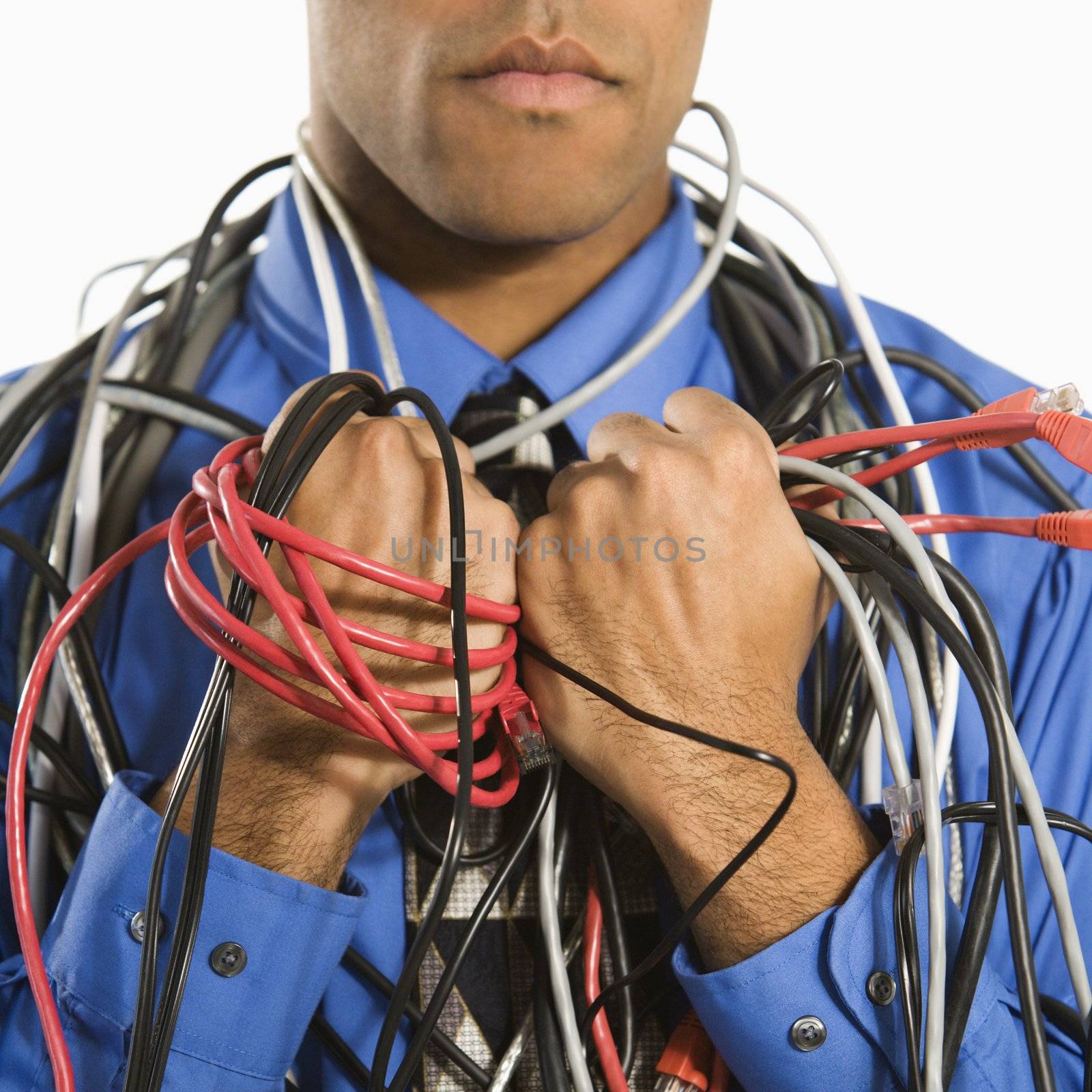 Man wrapped in cables. by iofoto