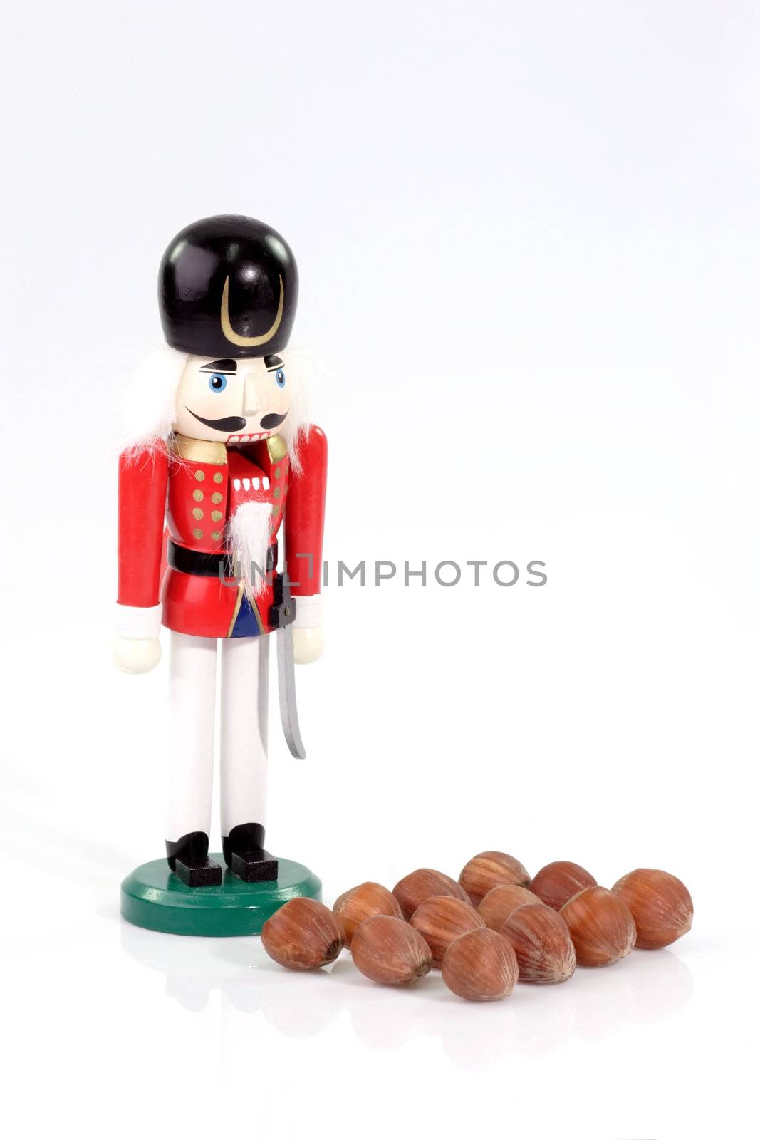 Nutchracker man with nuts on bright background