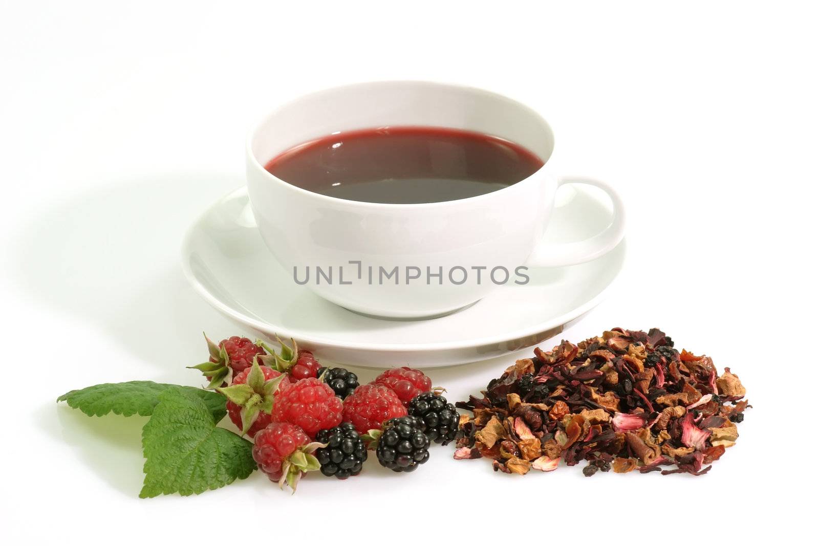 A cup of red fruit tea on bright background