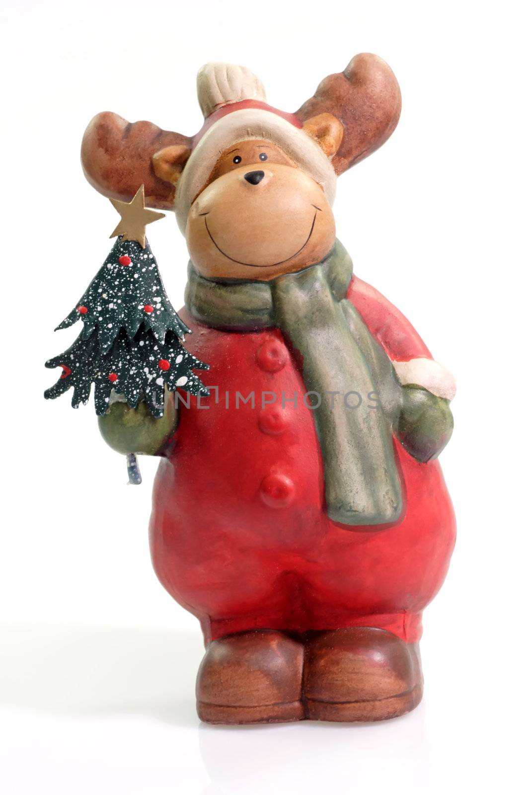 Figurine of a reindeer on bright background