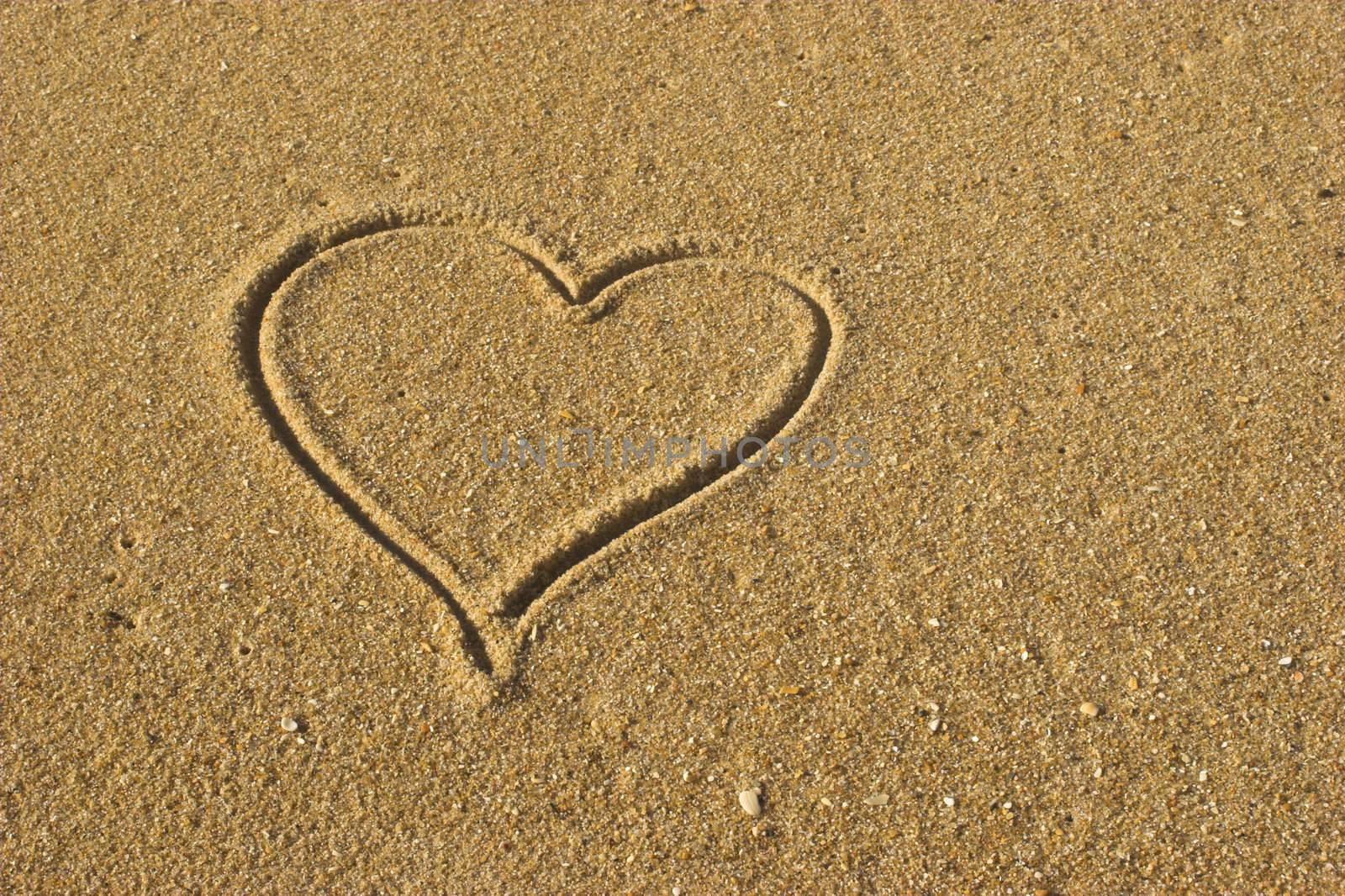 Picture of a Love message on a gold sand