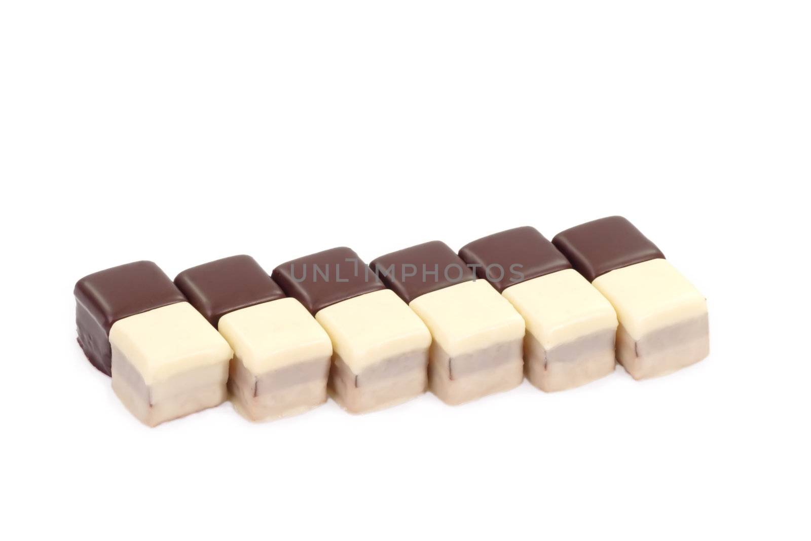 Black and white chocolate confection on bright background