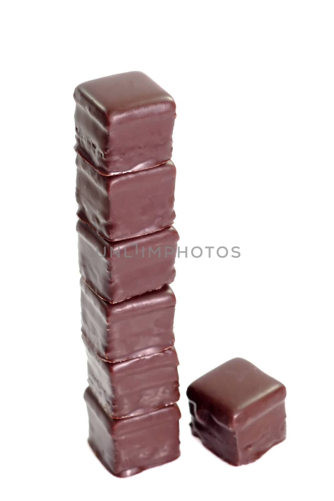Tower of sweet chocolate confection on bright background
