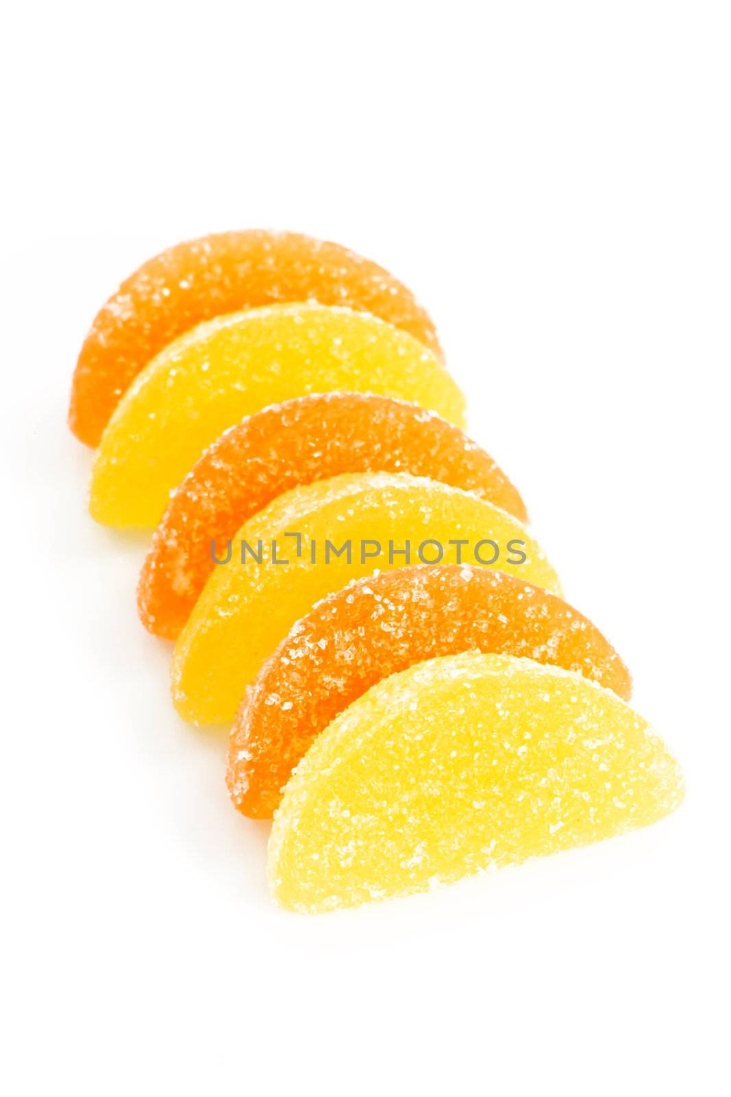 Orange and yellow wine gum on bright background