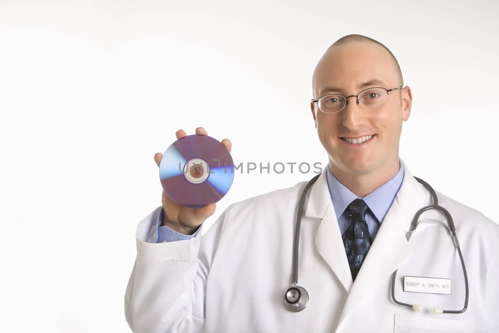 Caucasian mid adult male physician holding compact disc.