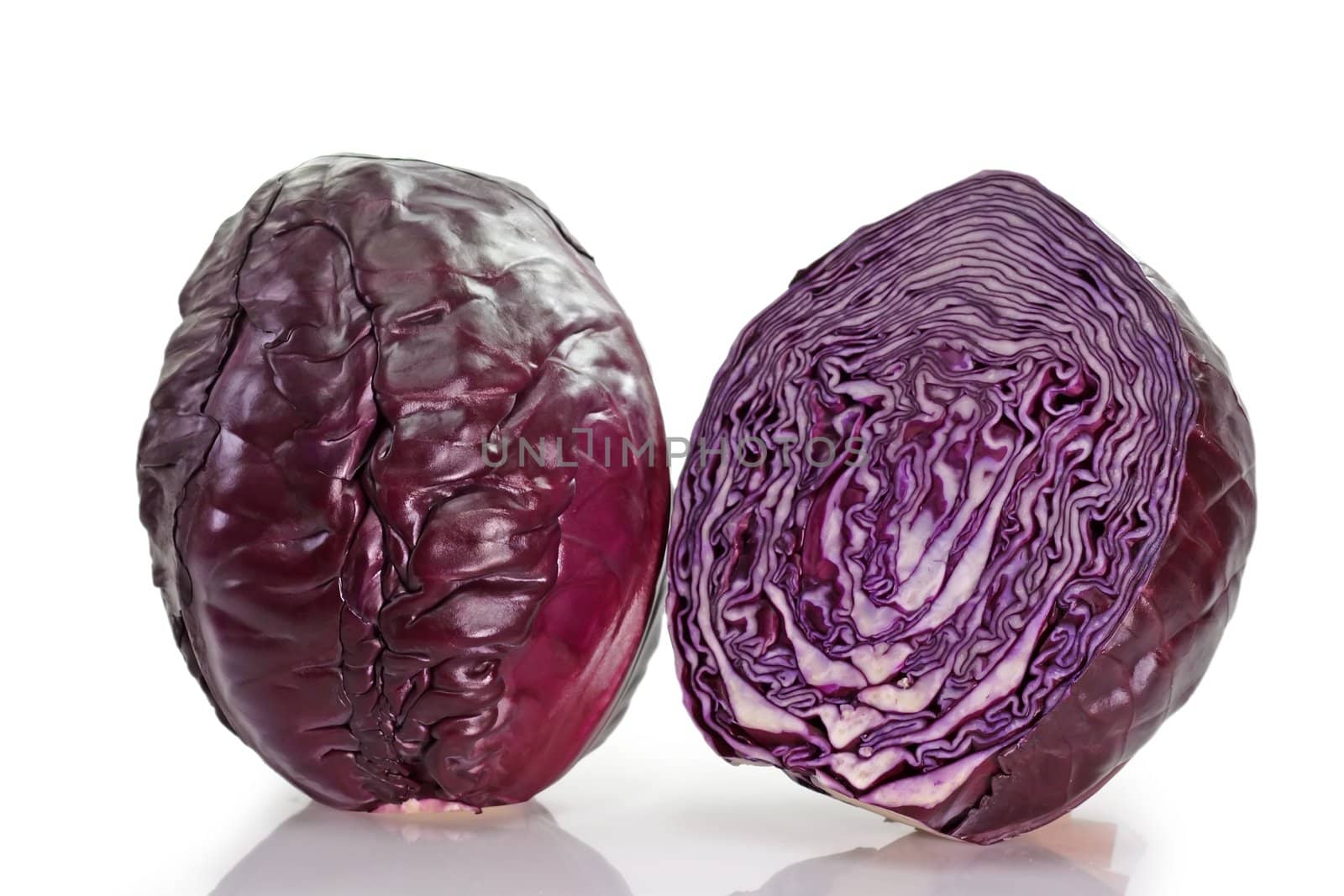 Two red cabbages on light background