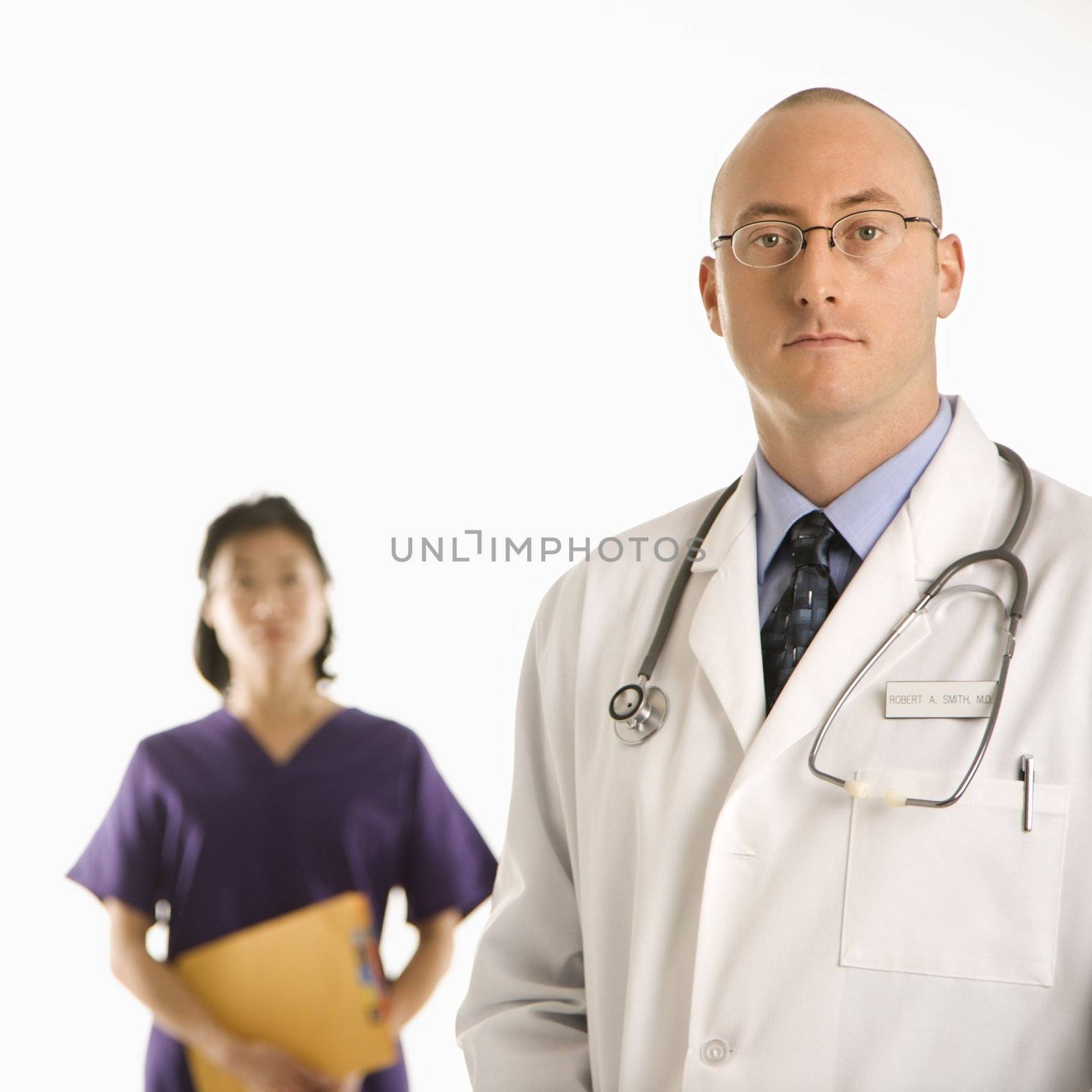 Man and woman doctors. by iofoto