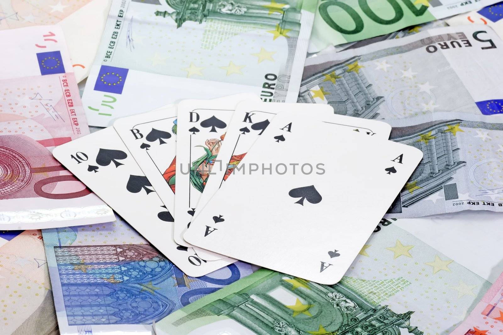 Poker cards on euro notes