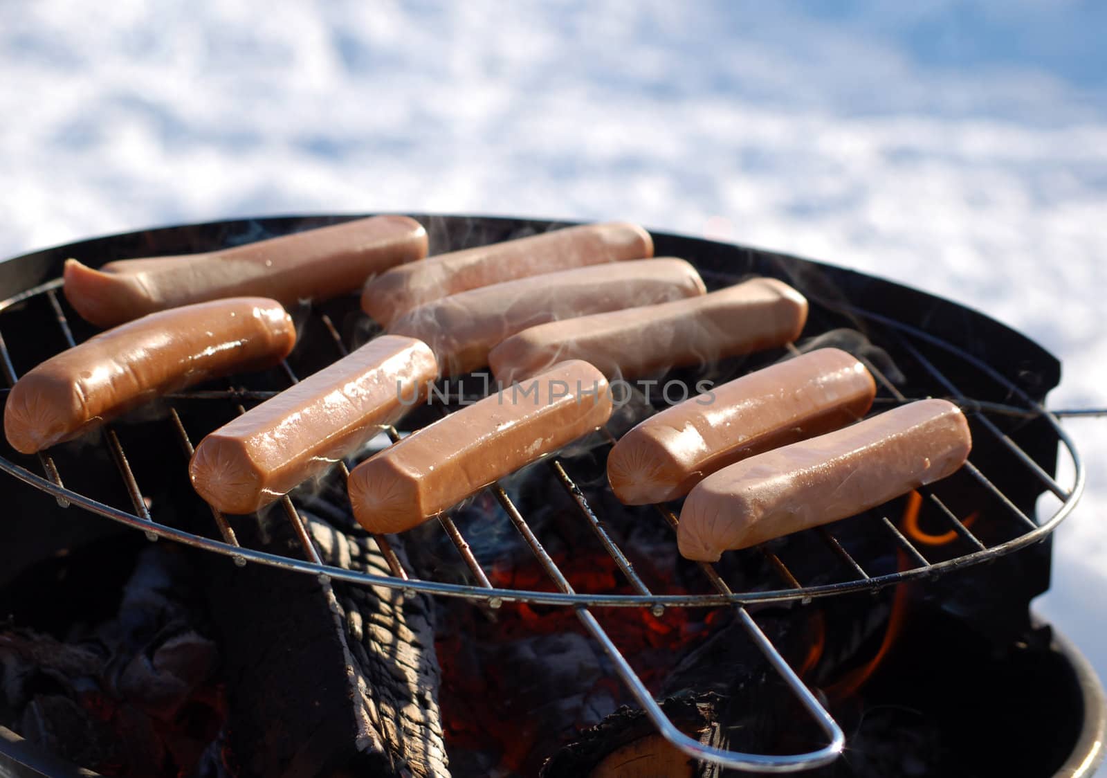 sausages on a grill