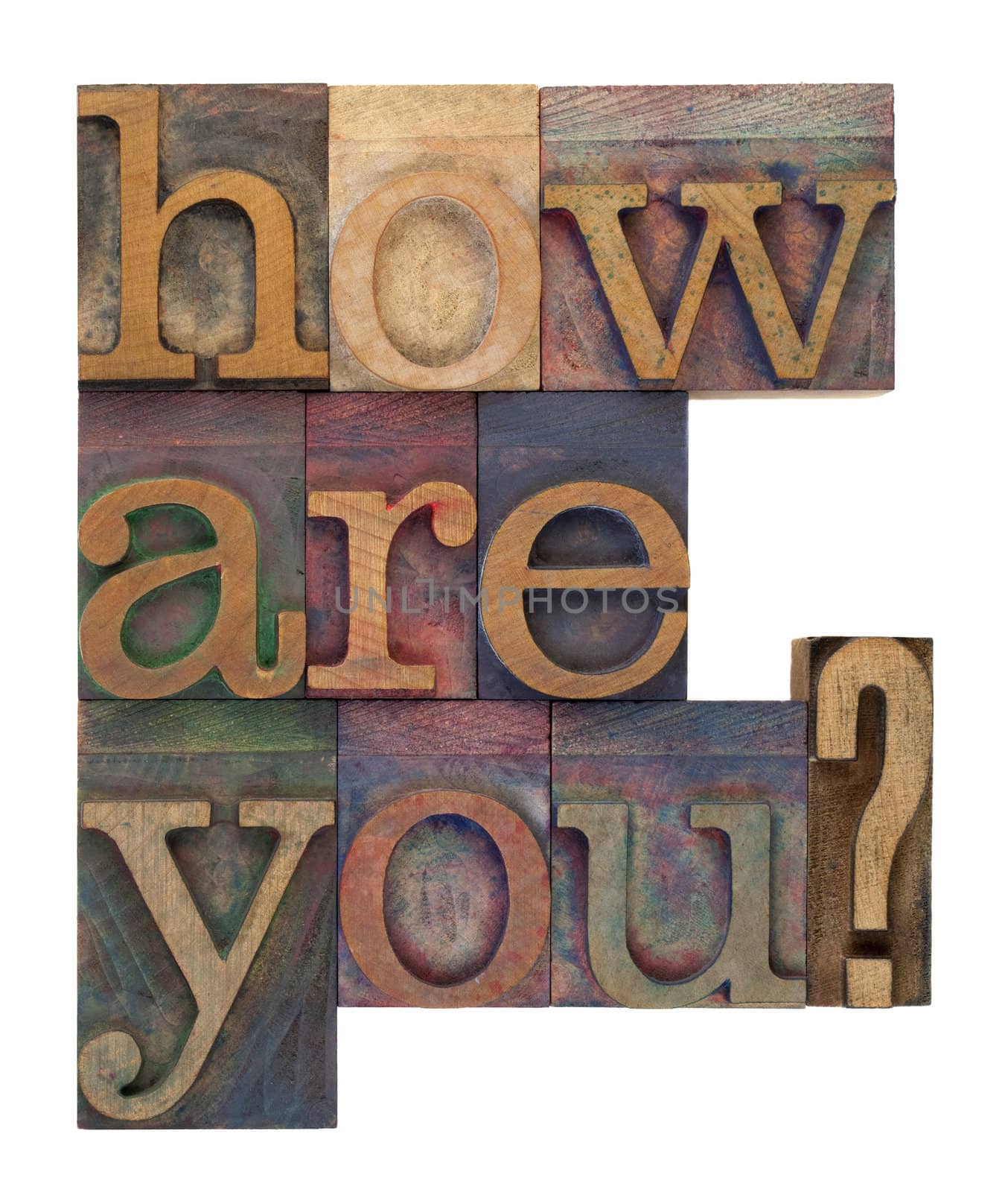 how are you question in vintage wooden letterpress type bloacks, stained by color ink, isolated on white