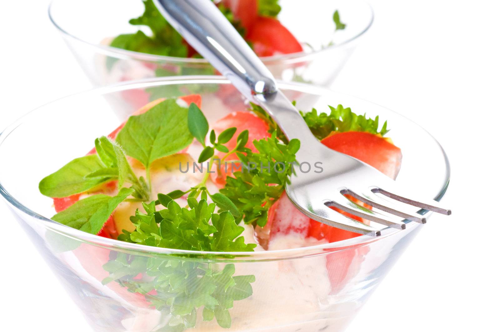 Delicious salad topped with a variety of fresh herbs.