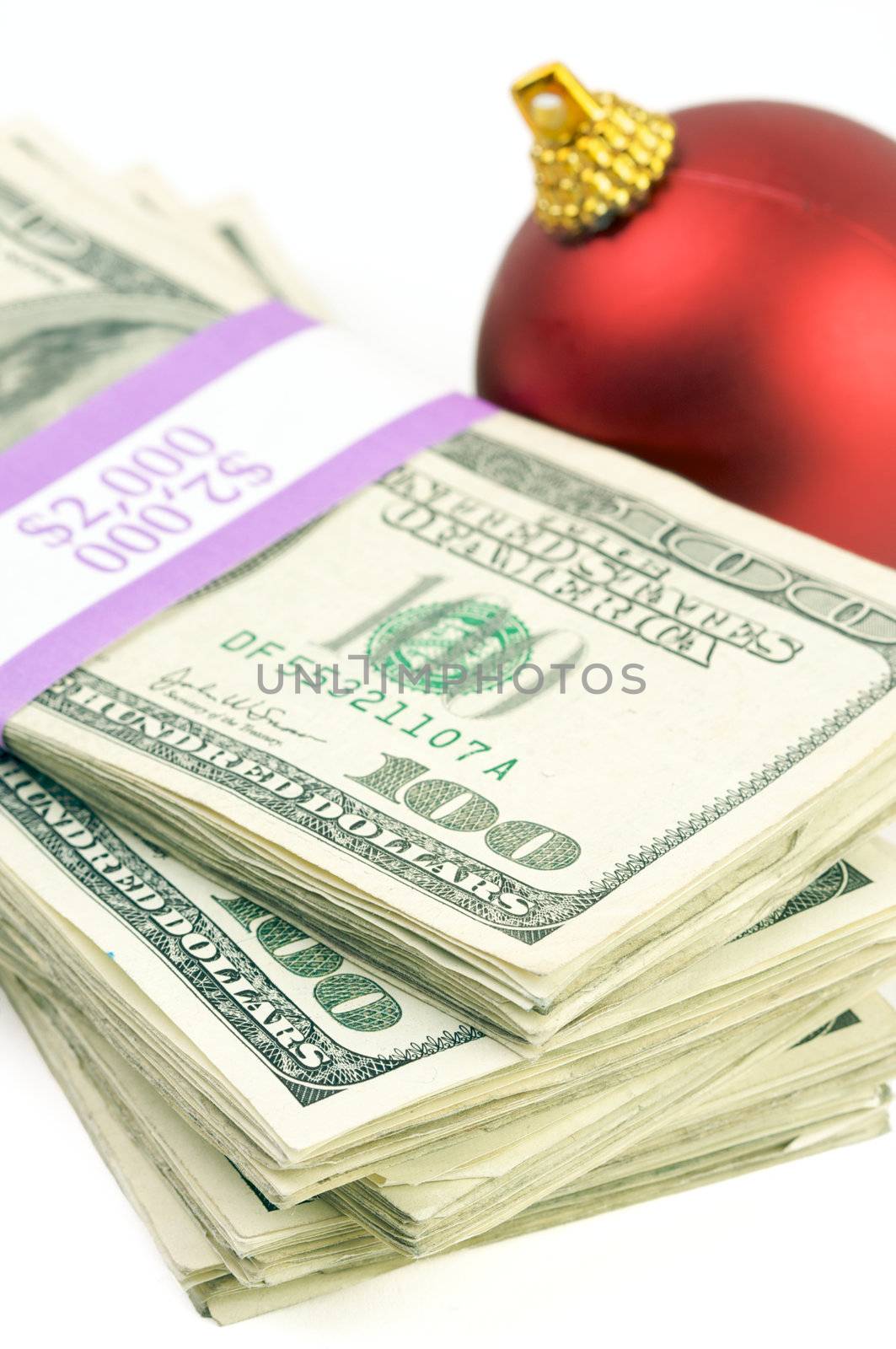 Money and Christmas Ornament on a White Background.