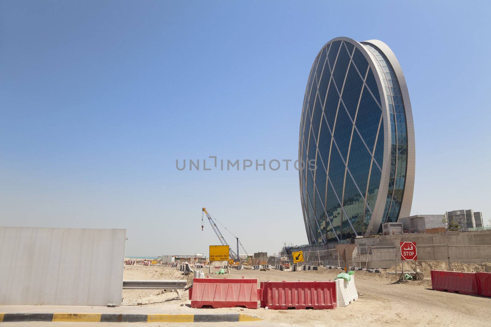 Image of a unique saucer shaped building under construction at Abu Dhabi, United Arab Emirates. One of the many beautiful buildings being constructed in this fast growing country.
