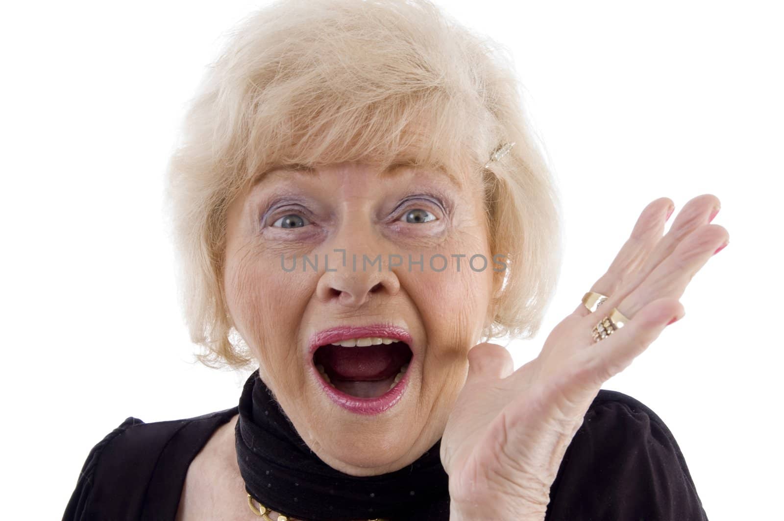 portrait of old woman looking at camera against white background