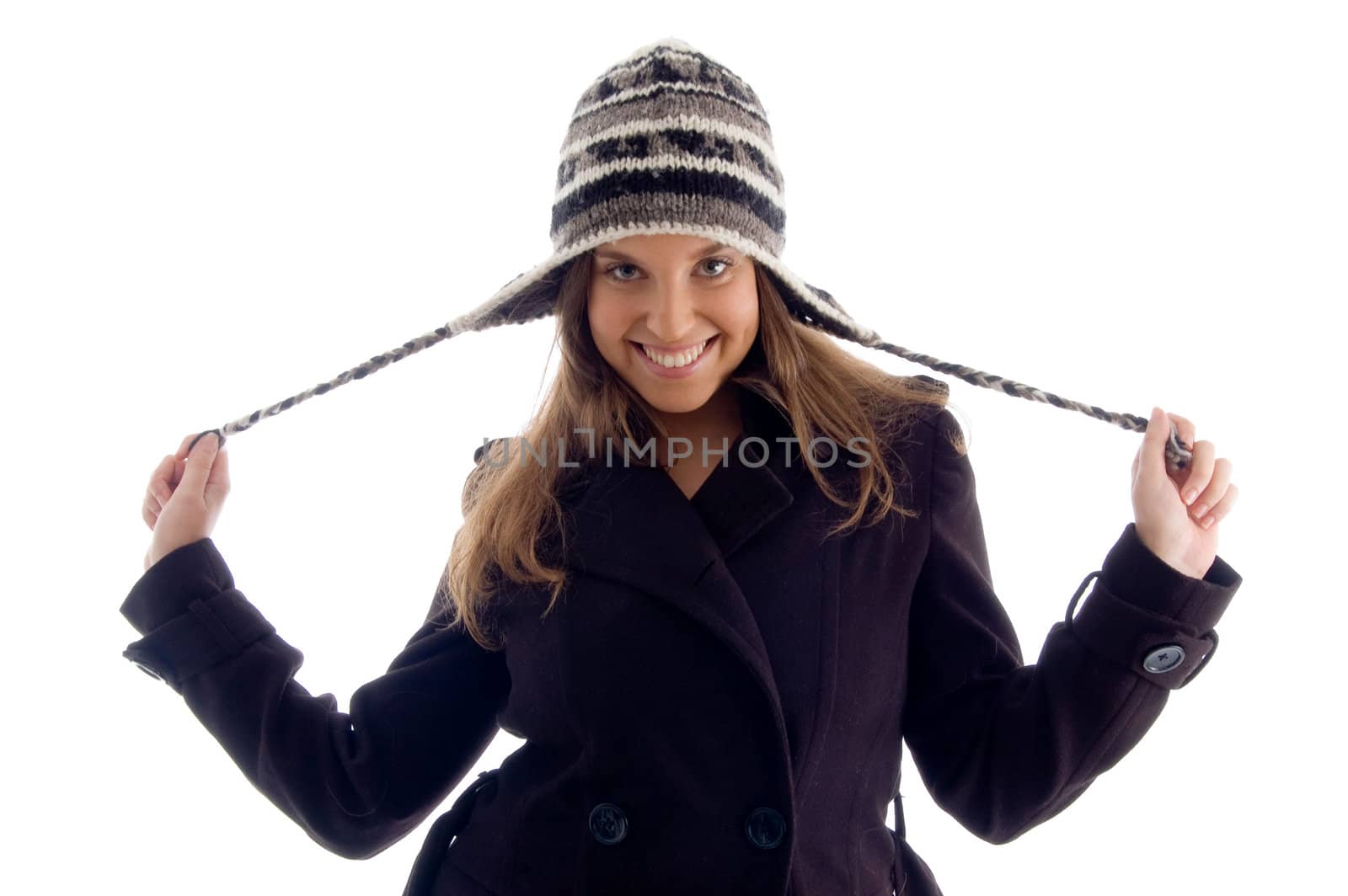 happy young girl wearing winter clothes on an isolated white background