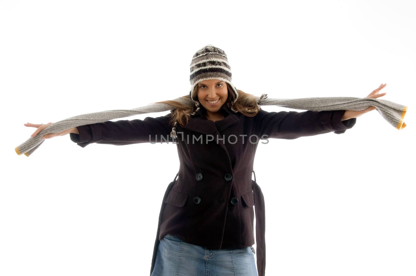 smiling cute girl stretching her scarf on an isolated background