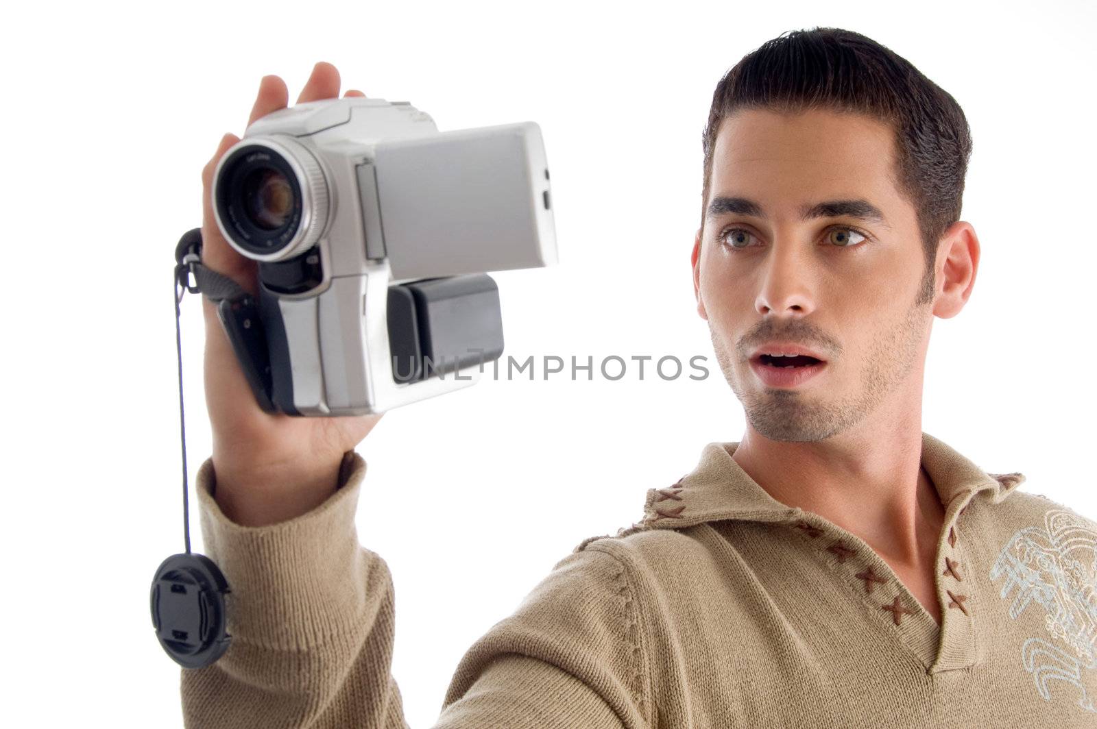 young man looking in to video from handy cam on an isolated white background
