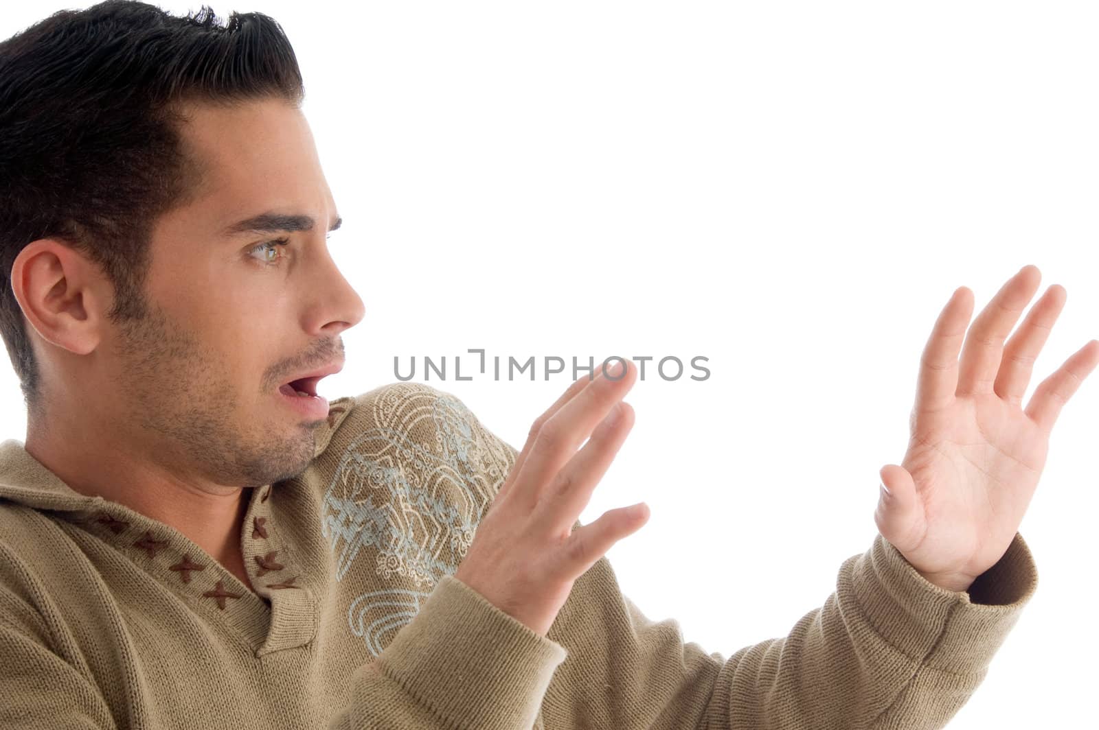 young guy surprised with facial expressions on an isolated background