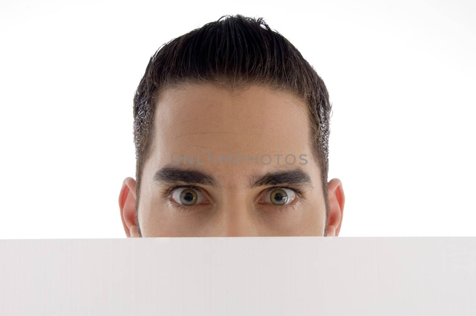man peeping over placard on an isolated white background