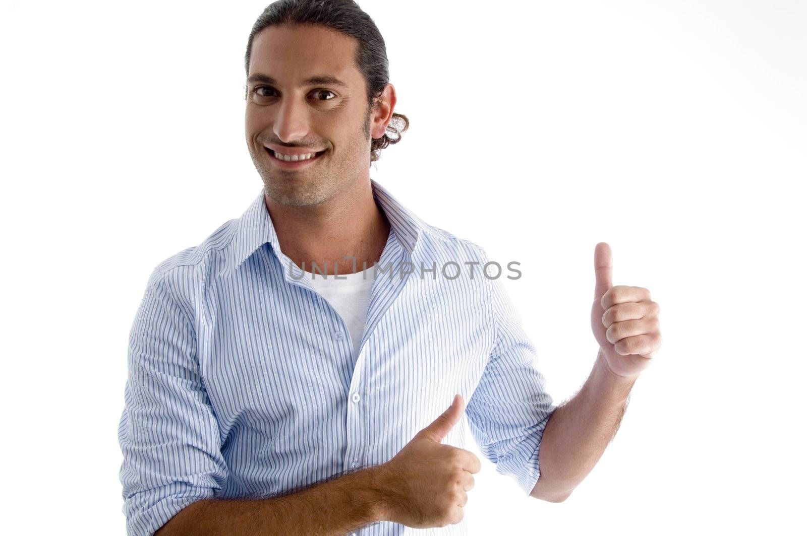 smiling male model with thumbs up against white background