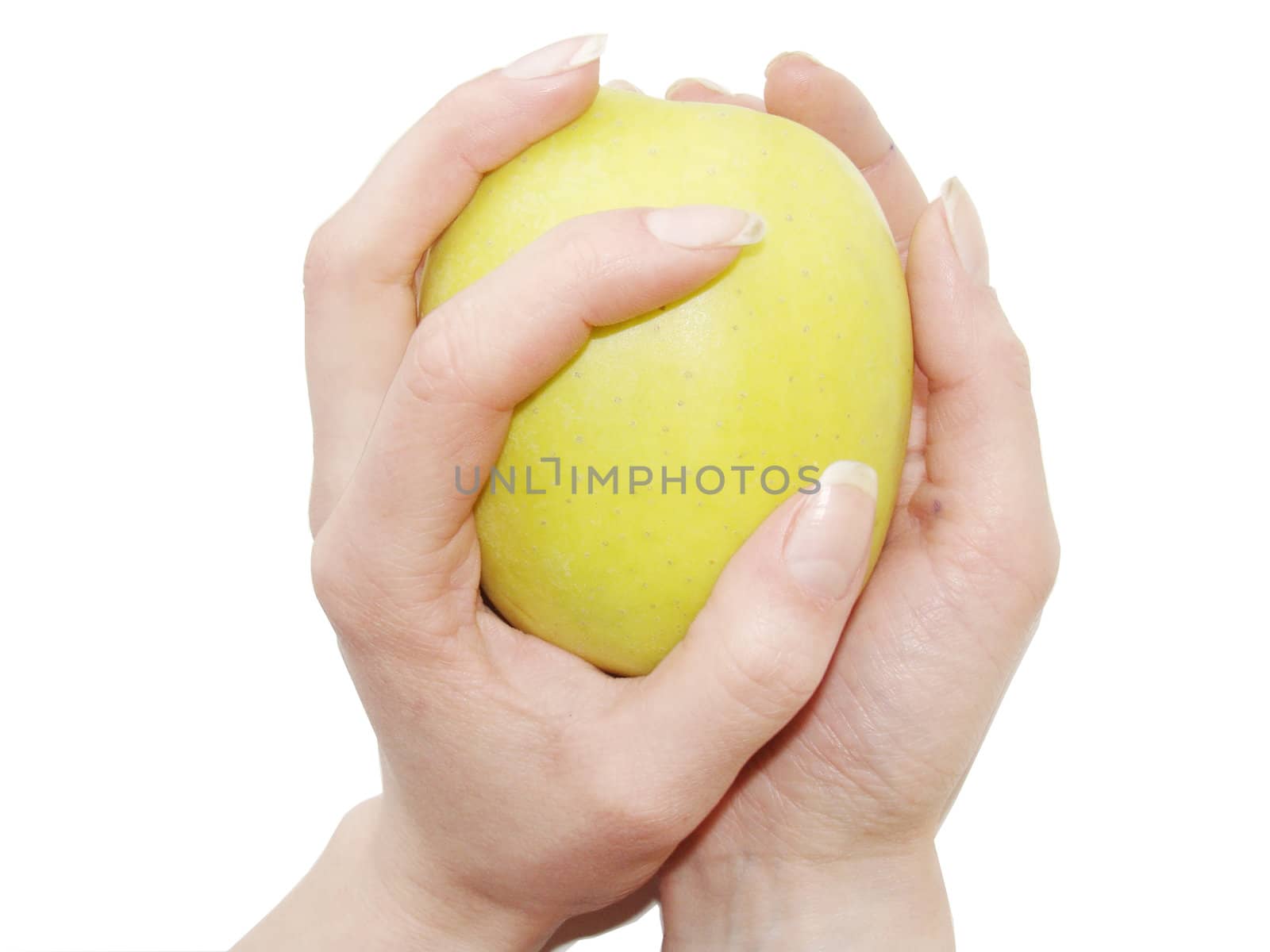 Apple in female hands close up