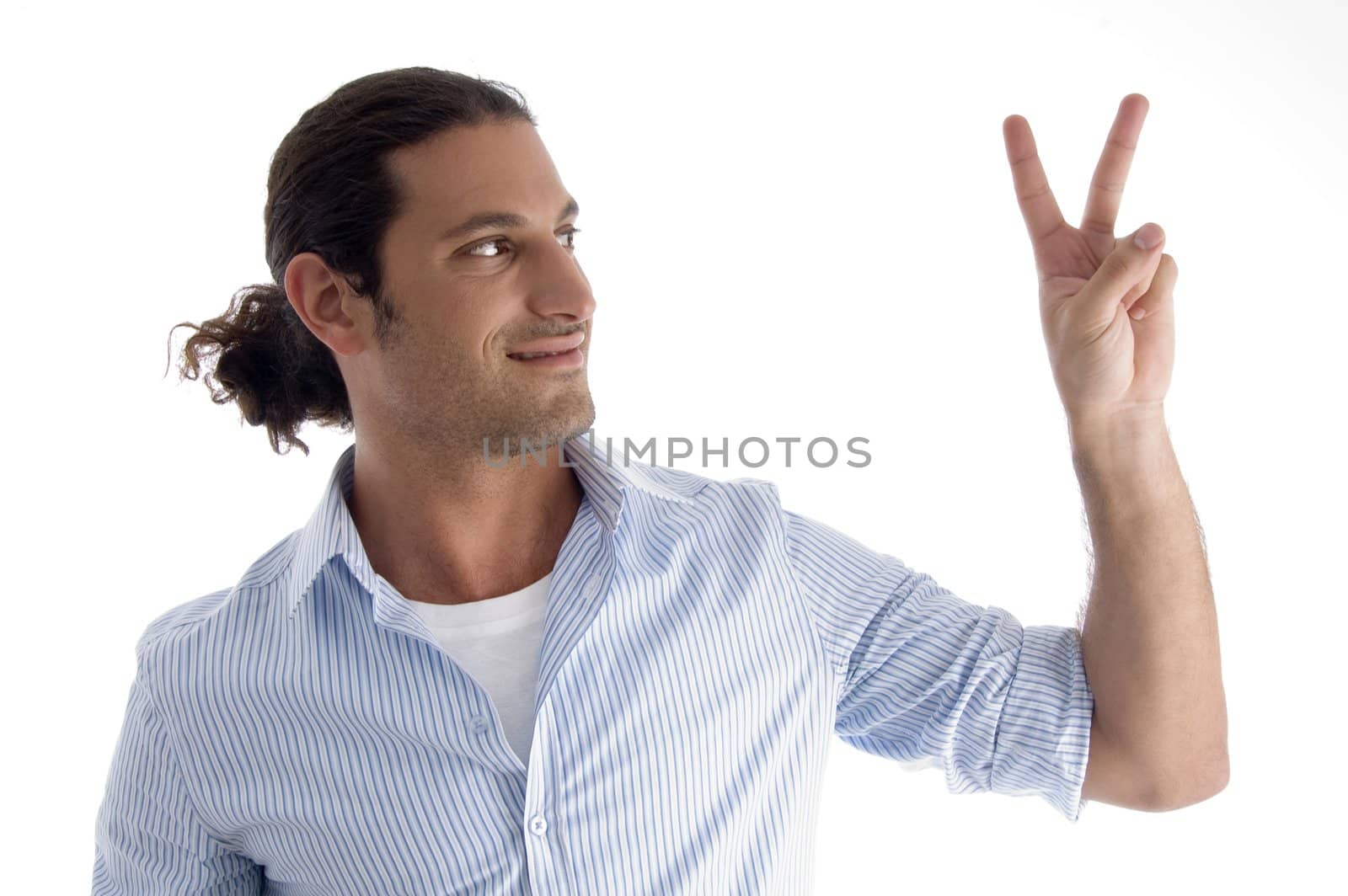 handsome model gesturing victory on an isolated background