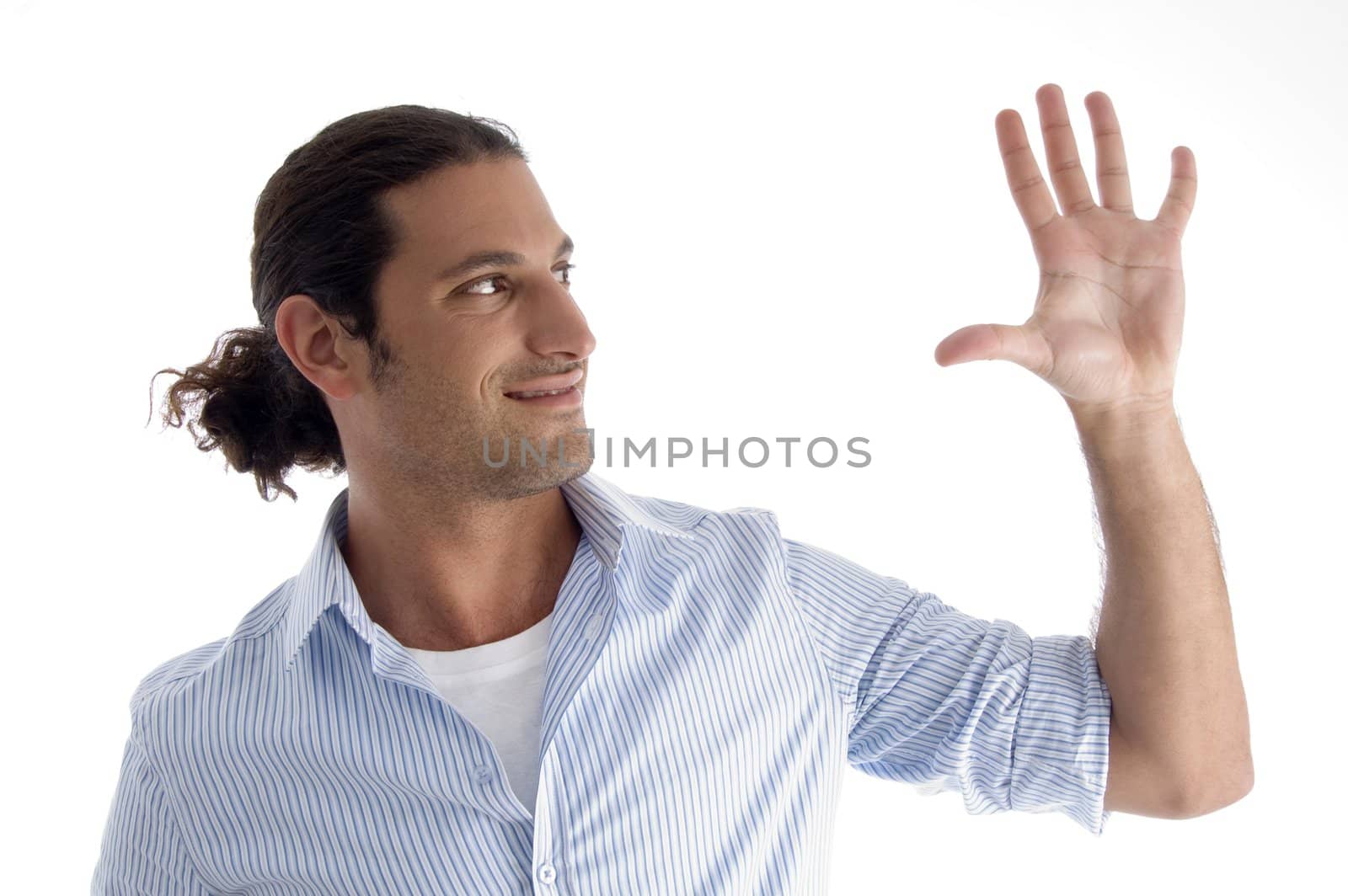 young handsome guy with open palm on an isolated white background