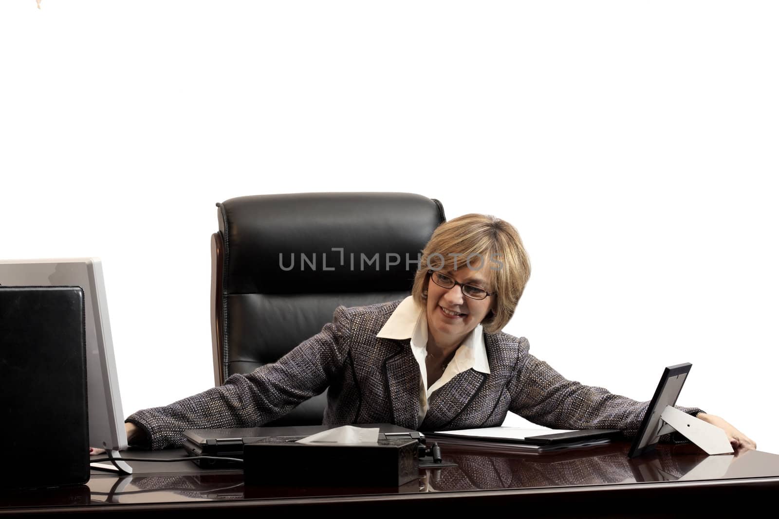Woman executive showing her feeling of success in getting a new position in her new office