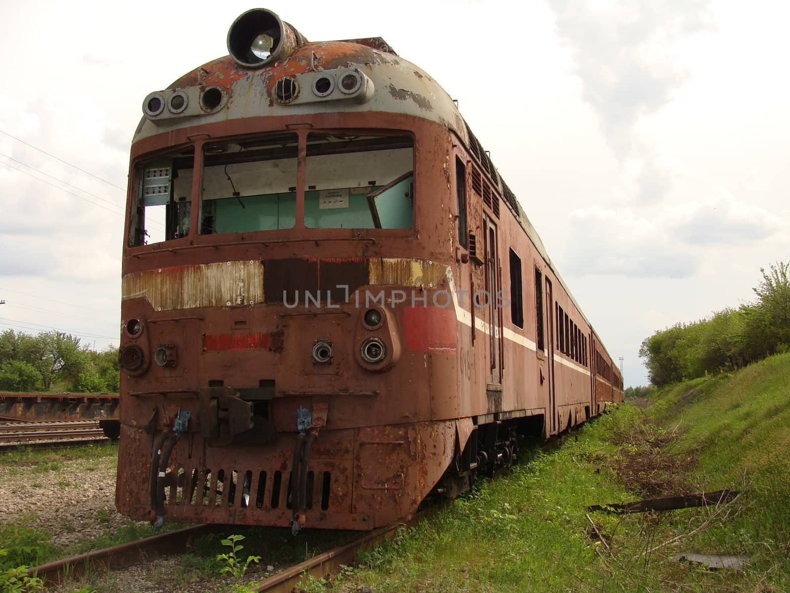 The old destroyed diesel engine a train on a side-track 