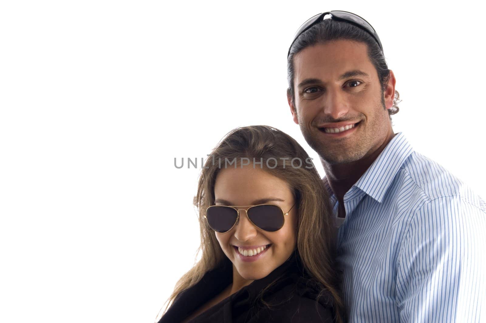 pretty couple posing together against white background