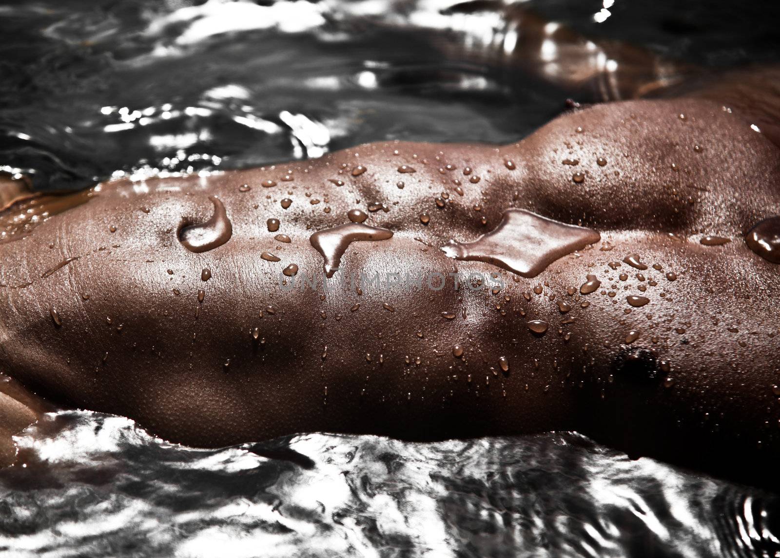 Sensual Closeup Photo Of A Male Abdomen An Pectorals Musckes Shining In Water