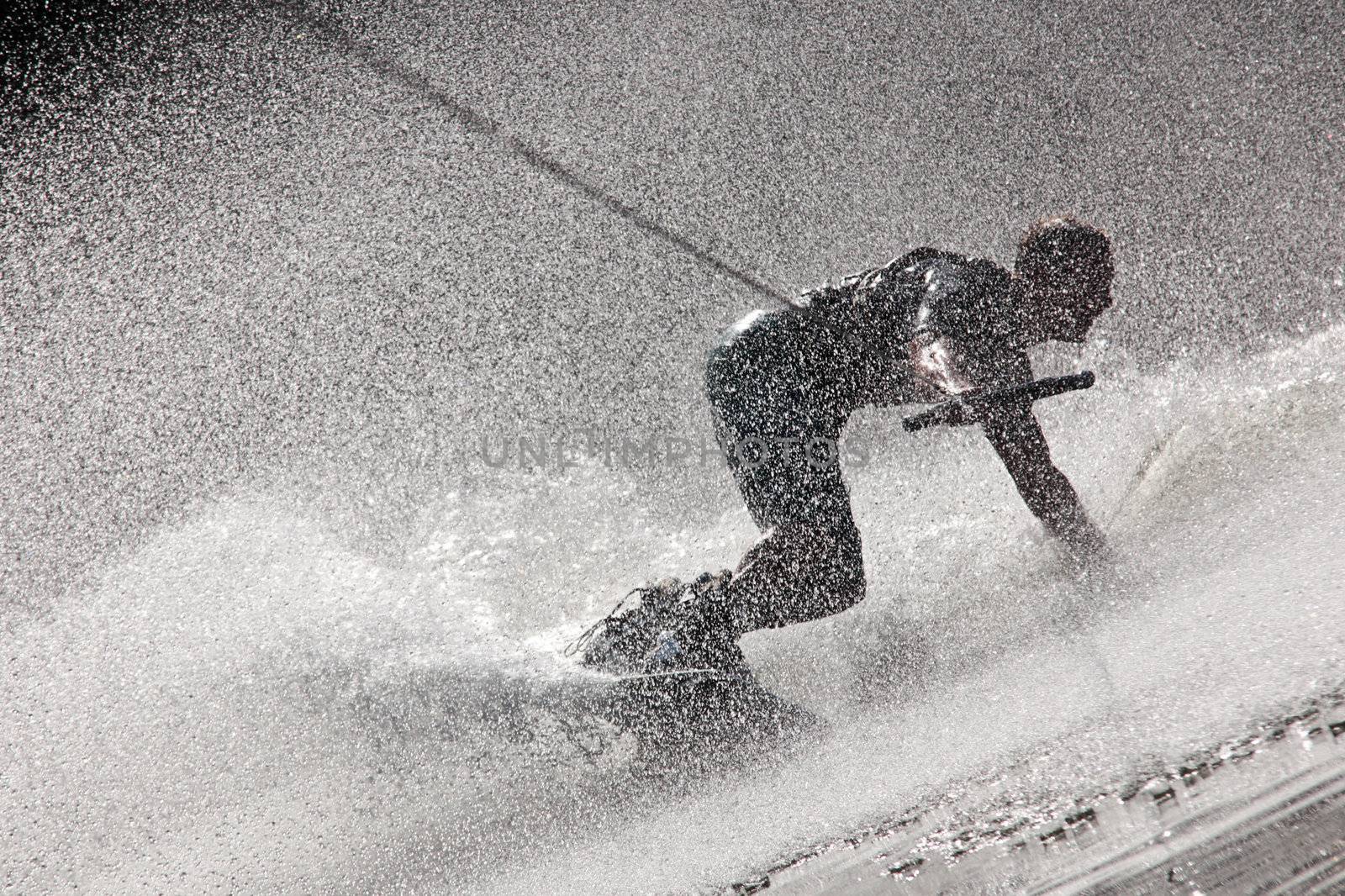 Photo Of A Dynamic Waterboarding Drift Creating Water Sprays