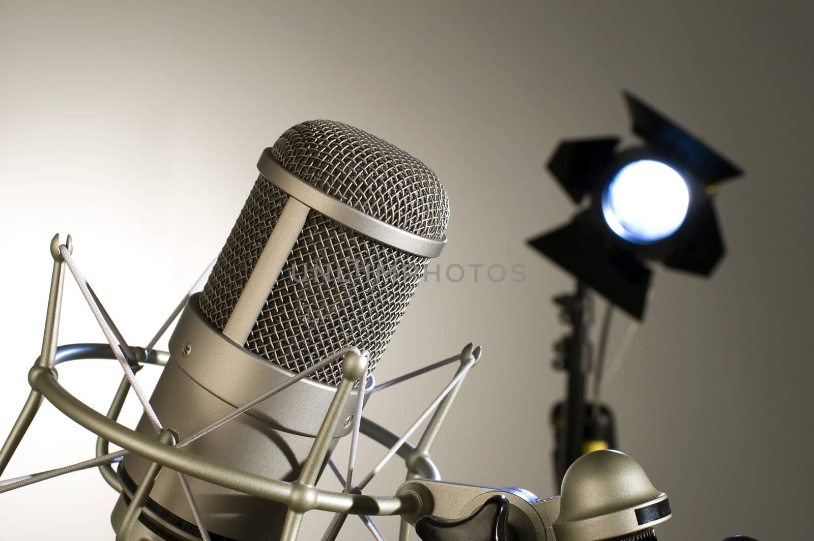 Microphone in studio on a light background.