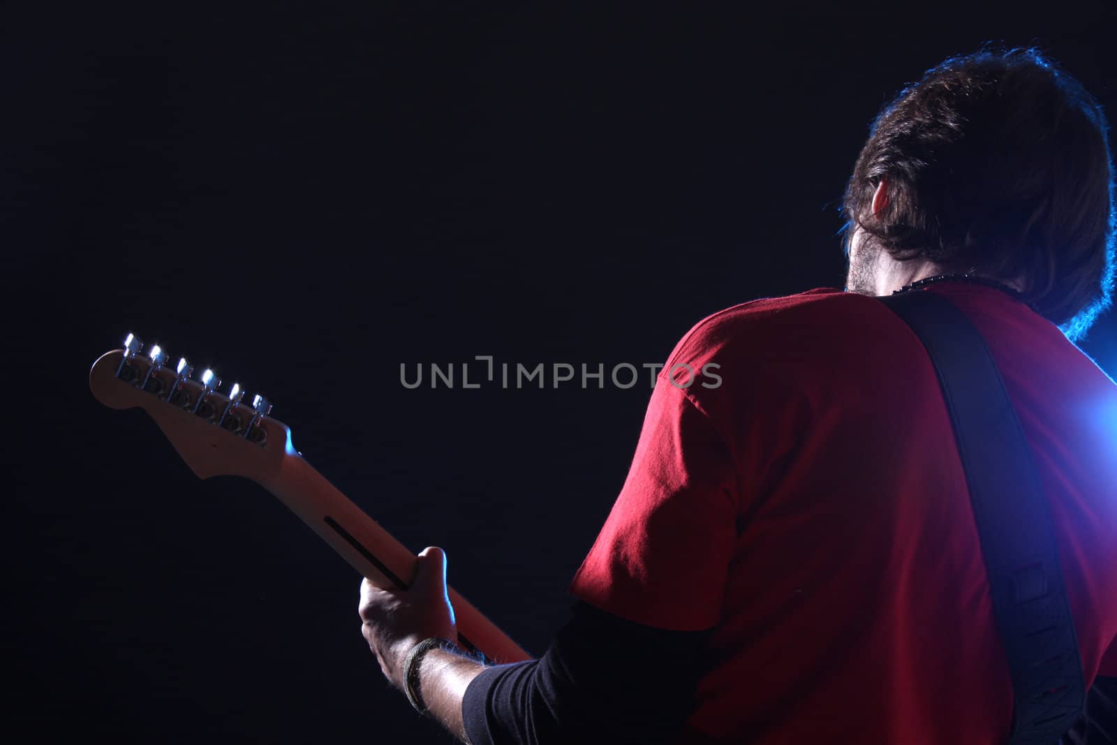 Guitar player on stage by Erdosain