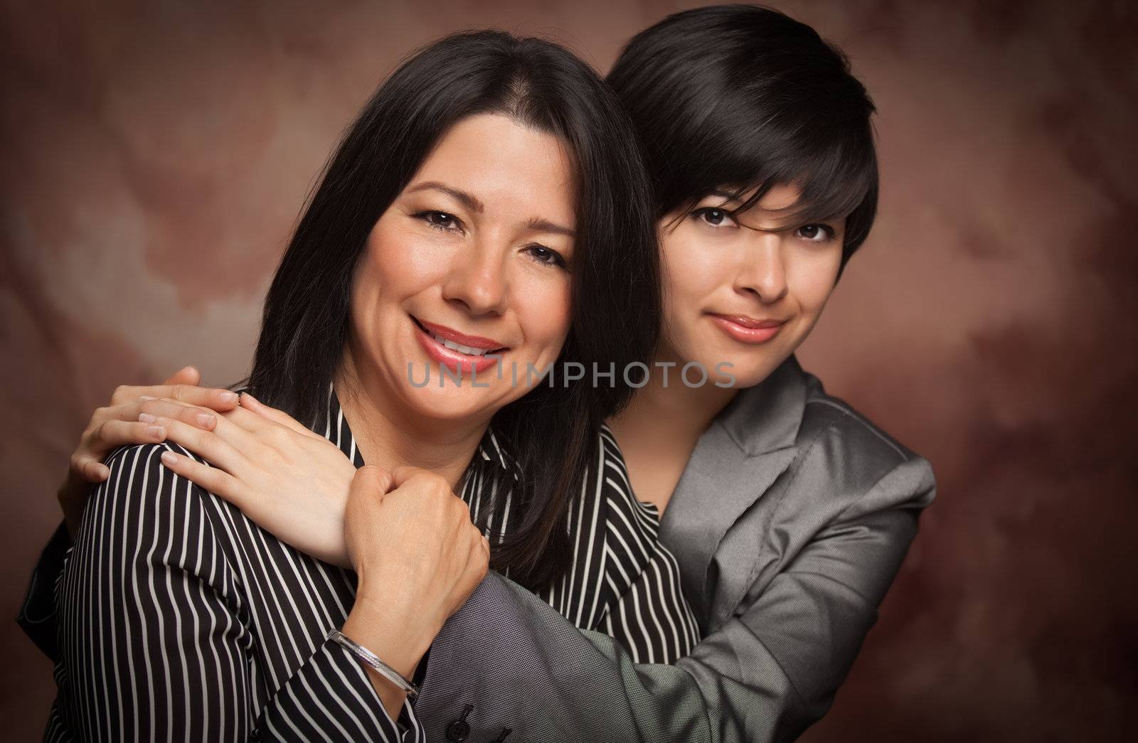 Attractive Multiethnic Mother and Daughter Studio Portrait by Feverpitched