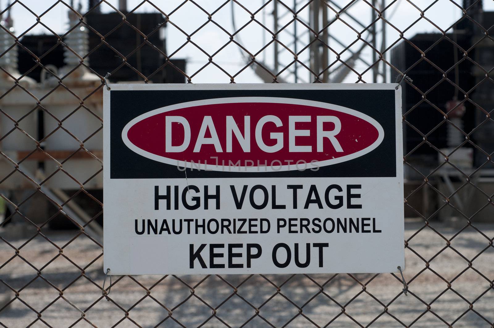 a sign stating of a high voltage danger and to keep out