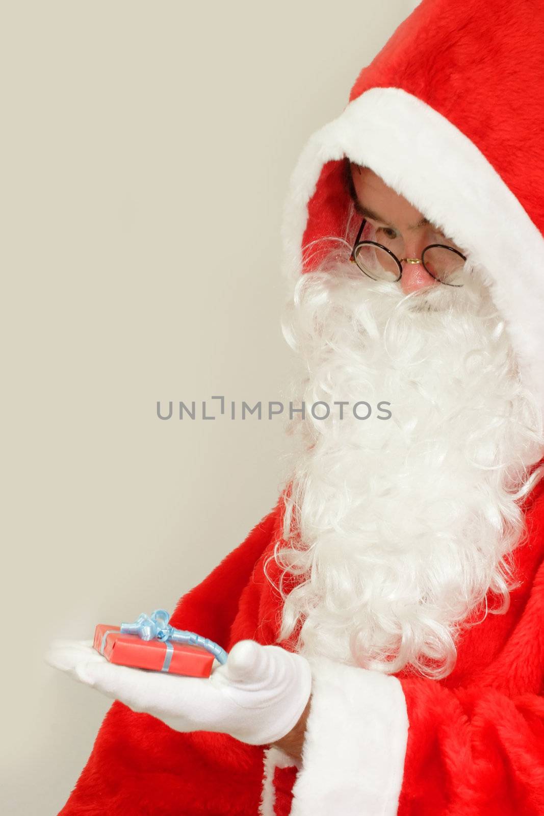 Male caucasian model of santa claus on grey background