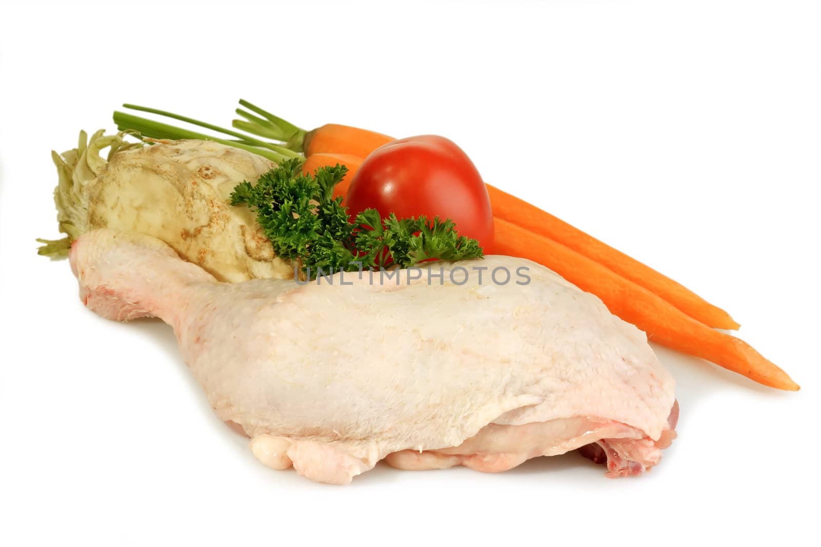 Raw chicken leg with vegetables on bright background