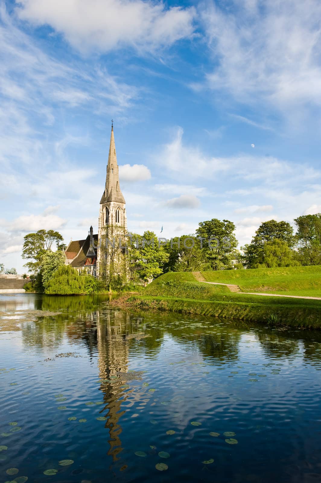 Old stone church by a park in Copenhagen in Denmark in Mai