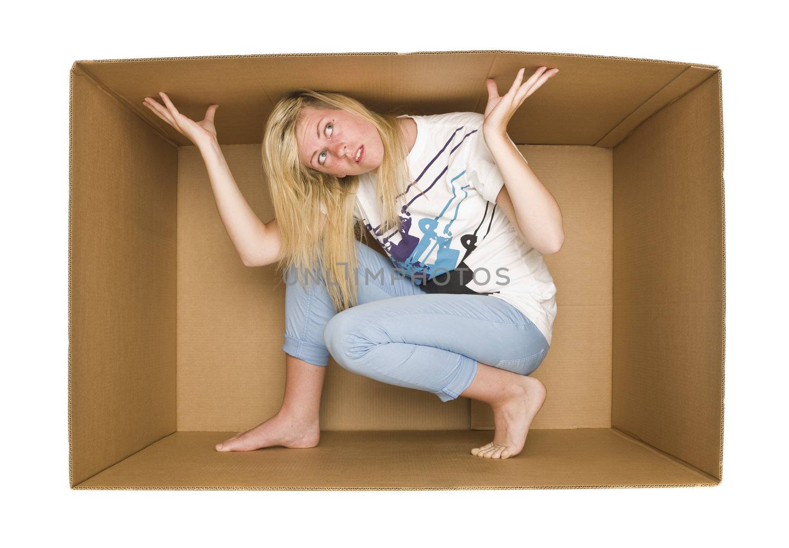 Young Woman inside a Cardboard Box isolated on white Backgreound