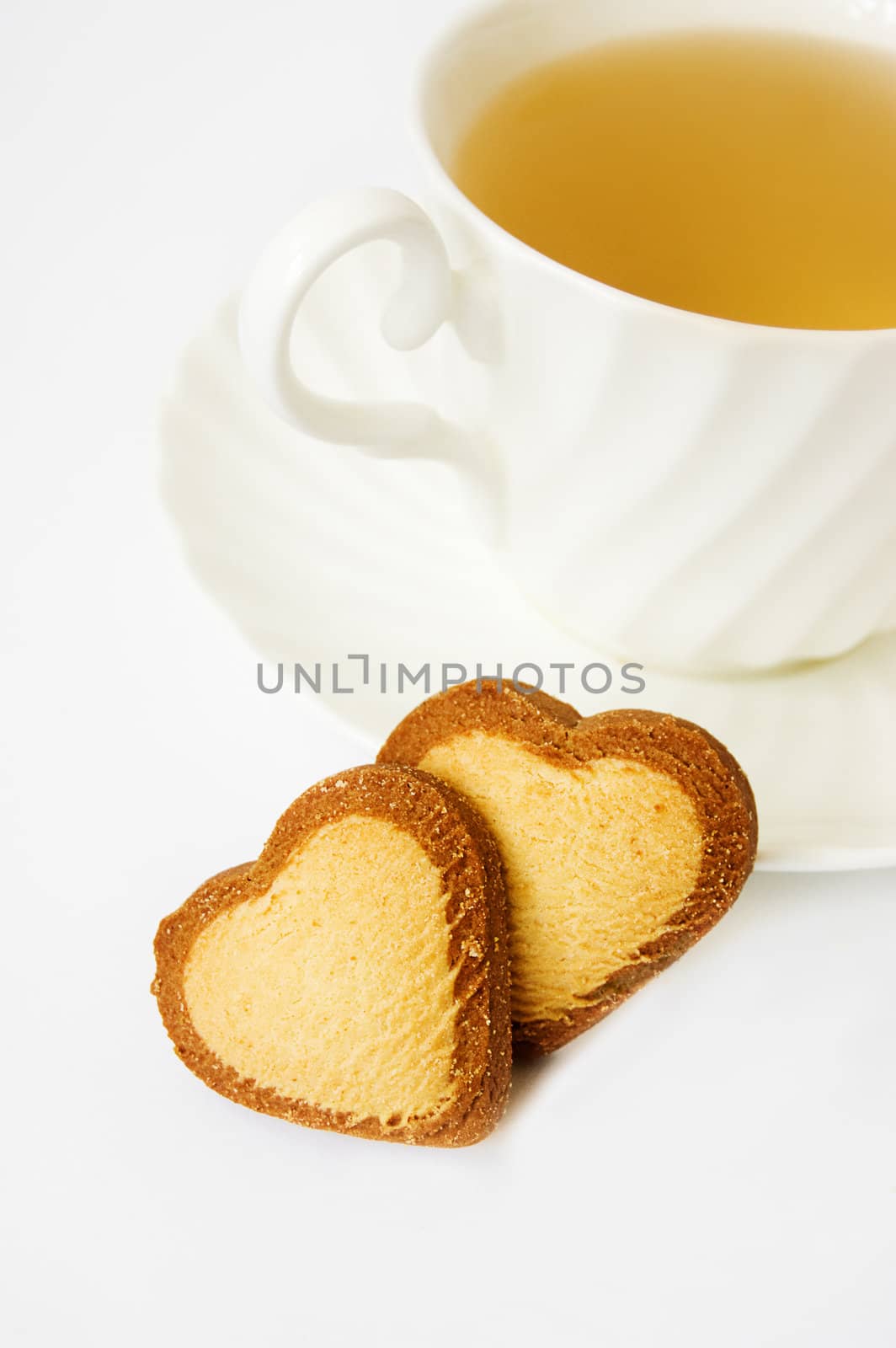 Cup of tea and heart shaped biscuits