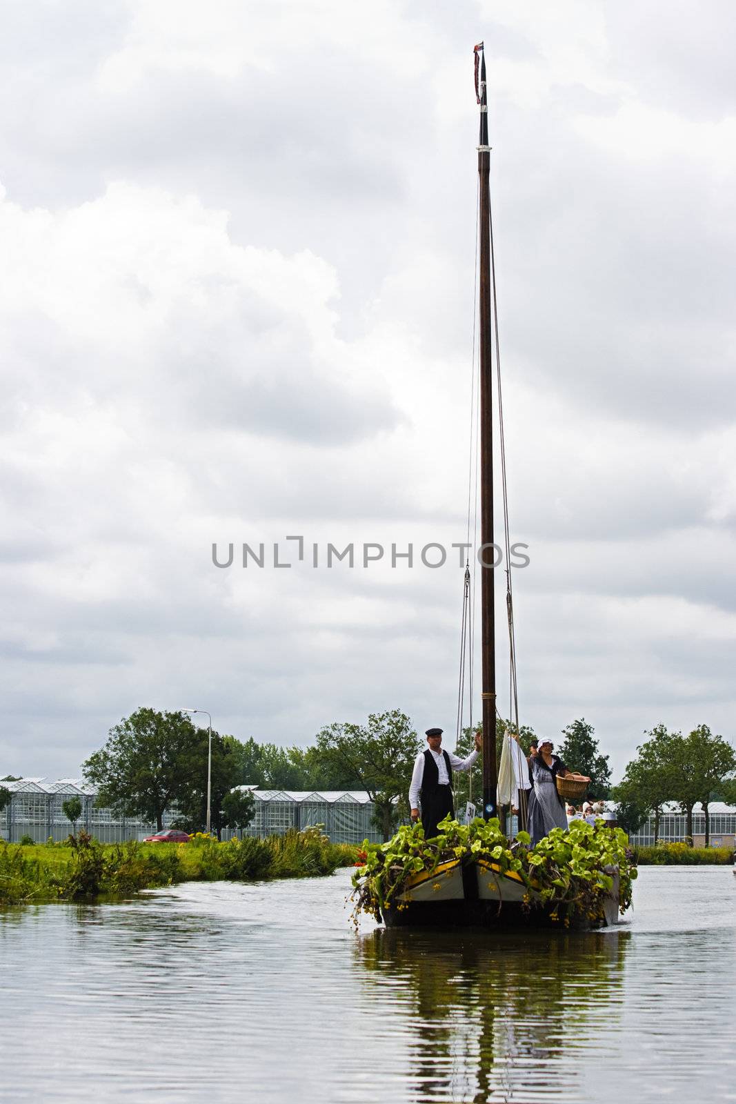 WESTLAND,THE NETHERLANDS - AUGUST 2009: Fabulous decorated boats in the spectacular annual Westland Floating Flower Parade August 02, 2010, Maasland, the Netherlands. 
