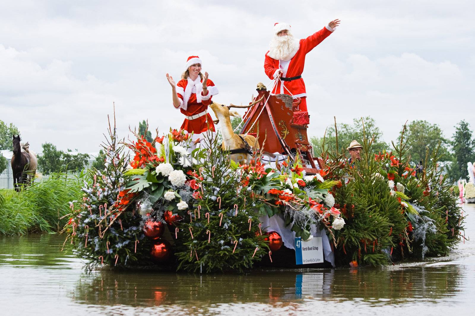 WESTLAND,THE NETHERLANDS - AUGUST 2009: Fabulous decorated boats in the spectacular annual Westland Floating Flower Parade August 02, 2010, Maasland, the Netherlands. 
