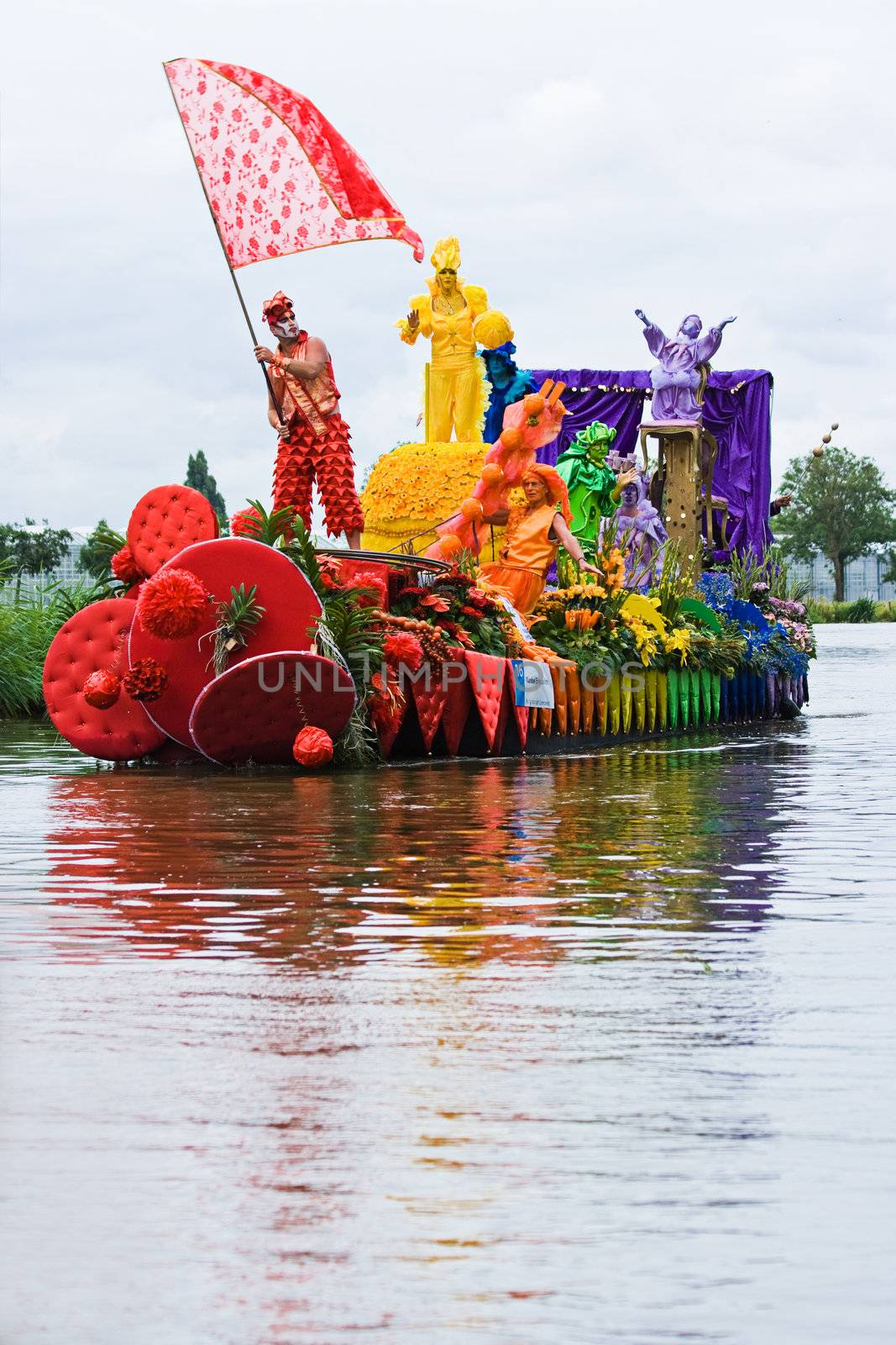 WESTLAND,THE NETHERLANDS - AUGUST 2009: Fabulous decorated boats in the spectacular annual Westland Floating Flower Parade August 02, 2010, Maasland, the Netherlands. 
