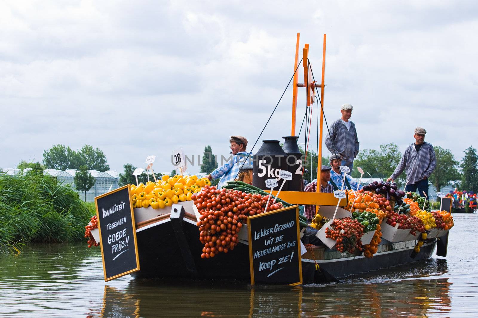 WESTLAND,THE NETHERLANDS - AUGUST 2009: Fabulous decorated boats in the spectacular annual Westland Floating Flower Parade August 02, 2010, Maasland, the Netherlands. 
