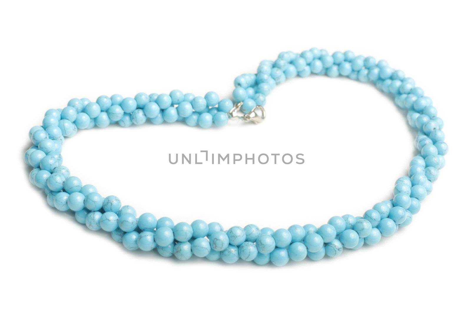 Blue lazurite necklace made from balls isolated on white background