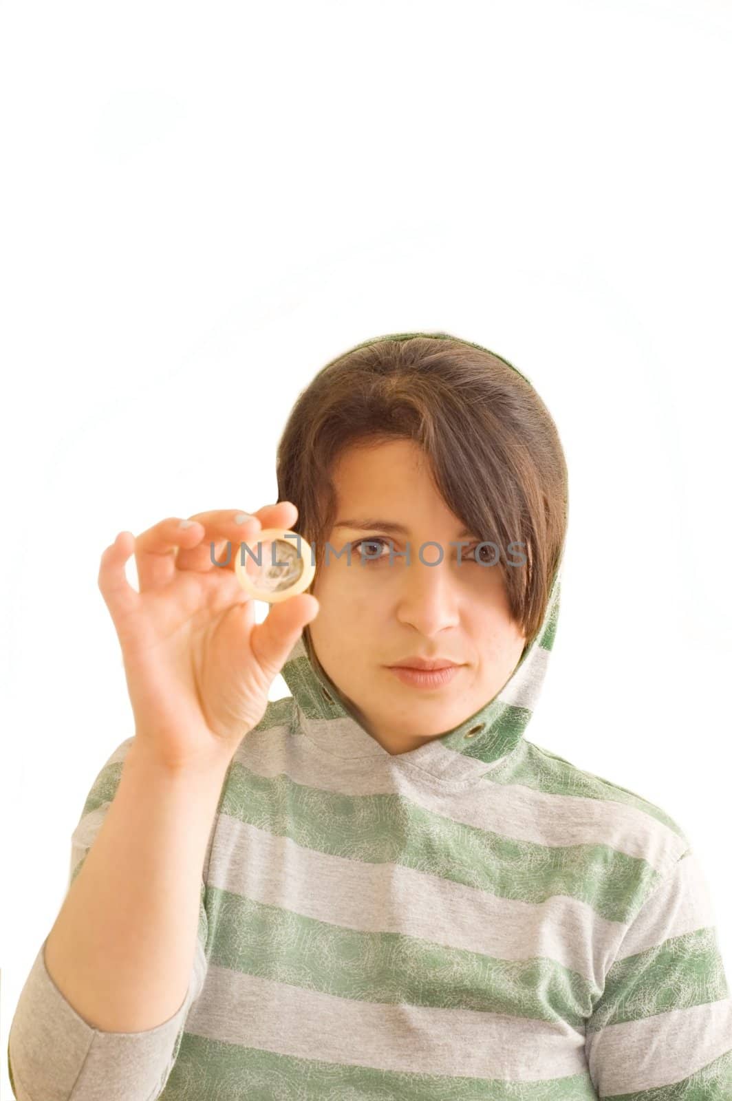 Adolescent female holding a condom. 