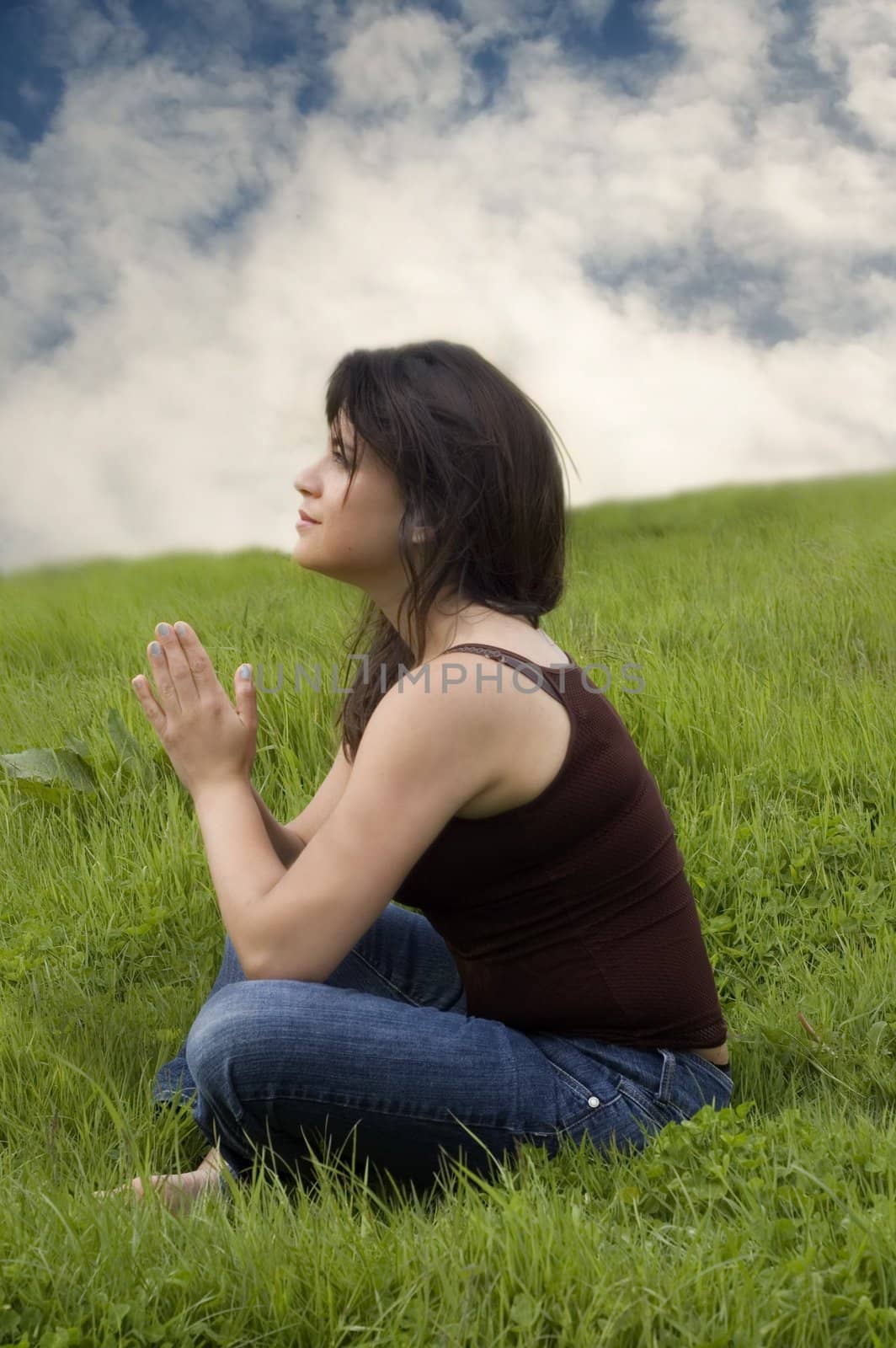 Woman sitting in praying pose