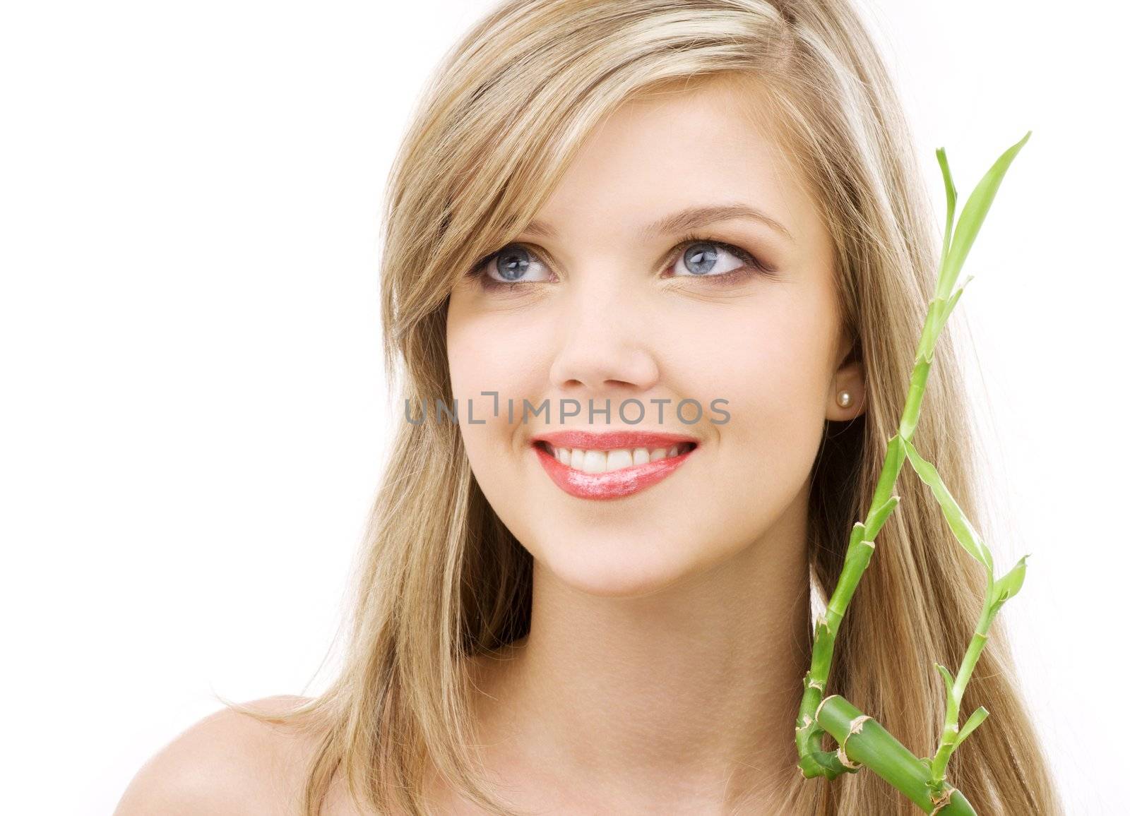 picture of lovely blue-eyed blonde with bamboo